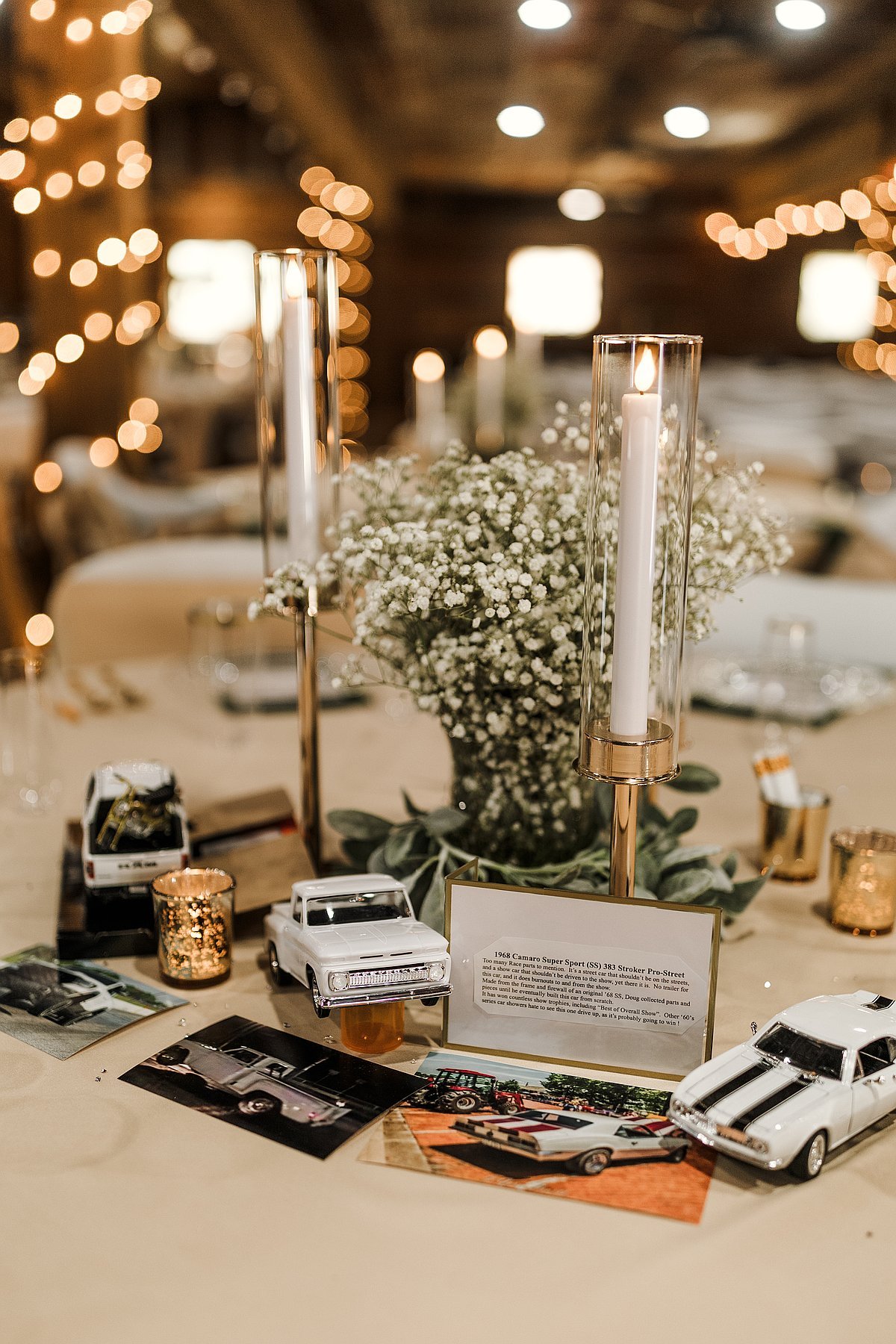 Baby breath centerpiece with candles and vintage car memorabilia