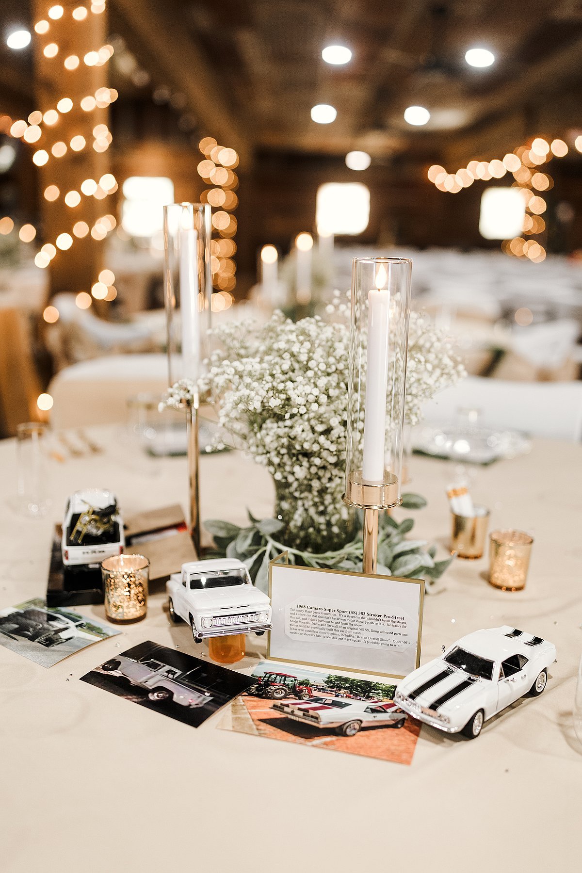 Elegant table setting with gold candle holders baby breath and greenery
